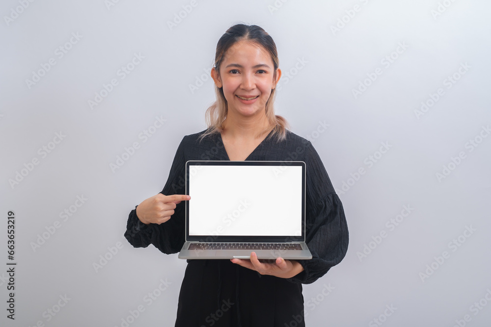 Portrait of young happy business woman holding white screen laptop. Attractive female in smart casual wear holding a computer and present her job or work. Digital tachnology communication concept. Portrait of young happy business woman holding white screen laptop. Attractive female in smart casual wear holding a computer and present her job or work. Digital tachnology communication concept.