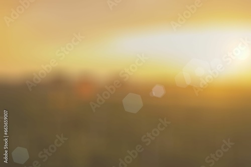 Soft, blurred background with round, glowing lights of the picturesque orange sunset