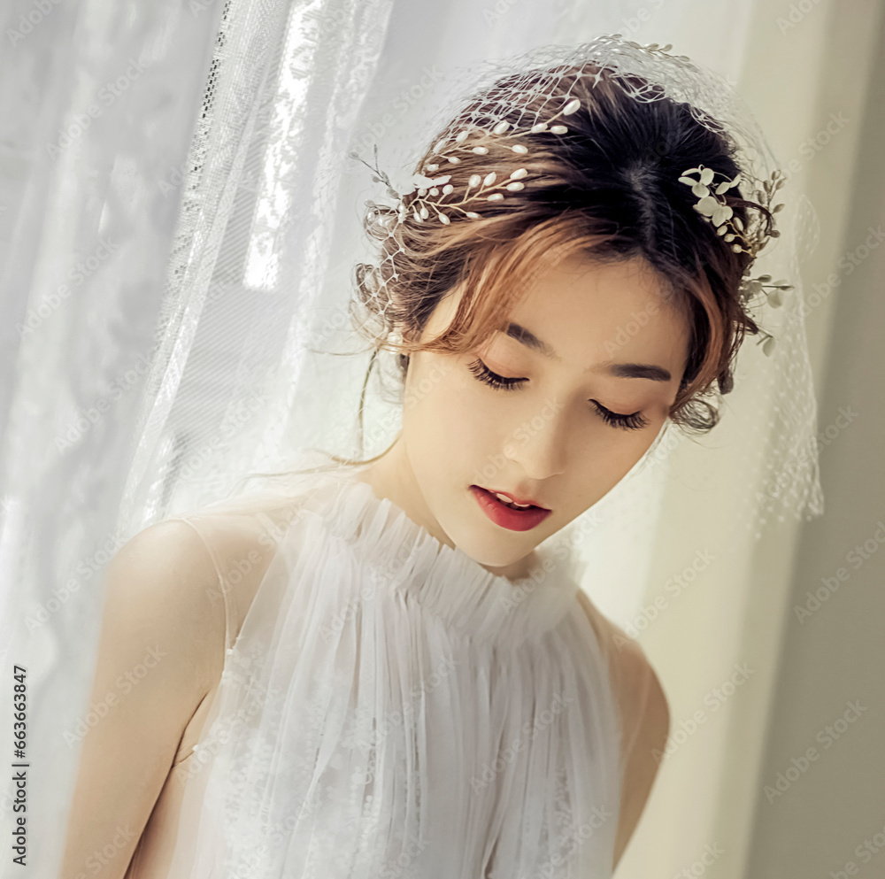 Asian girl in beautiful wedding dress in front of screen window Asian girl in beautiful wedding dress in front of screen window