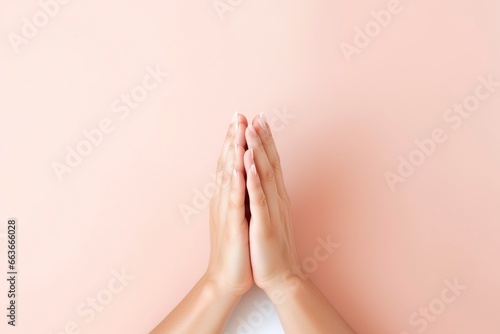 Close-up of two hands with palms together  as if in prayer  on isolated background.