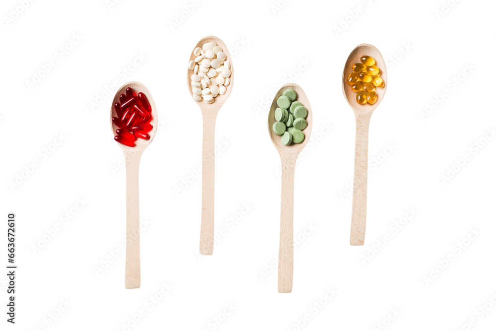 Top view Variety of vitamin and mineral pills in wooden spoon on Colored background. Top view of assorted pharmaceutical medicine pills. Dietary supplement healthcare product Top view Variety of vitamin and mineral pills in wooden spoon on Colored background. Top view of assorted pharmaceutical medicine pills. Dietary supplement healthcare product