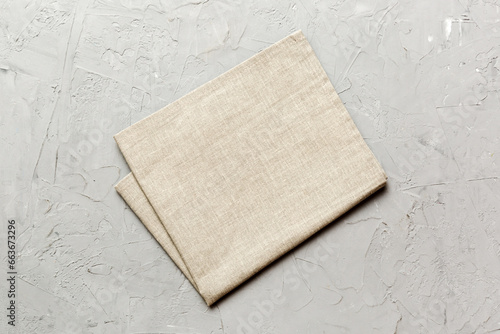 top view with gray kitchen napkin isolated on table background. Folded cloth for mockup with copy space, Flat lay. Minimal style