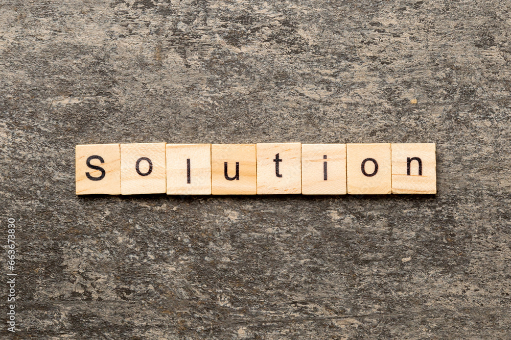 Fototapeta premium solution word written on wood block. solution text on table, concept