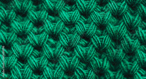 Background of striped knitted sweater in green color.
