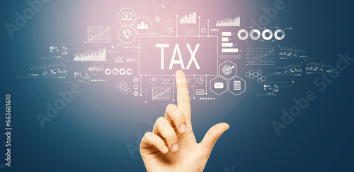 Tax theme with hand pressing a button on a technology screen