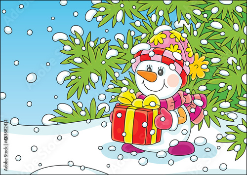 Happy toy snowman holding a...
