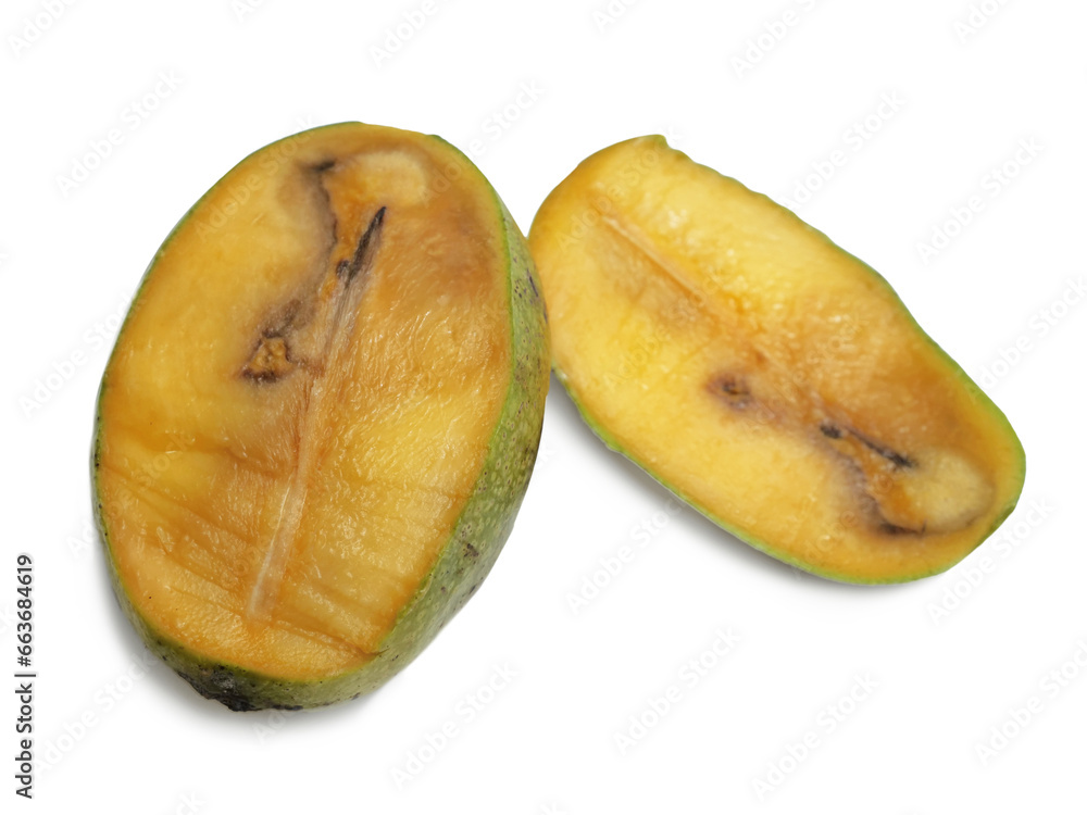 Rotten mango, sliced fruit showing wormholes inside, isolated cut out Rotten mango, sliced fruit showing wormholes inside, isolated cut out