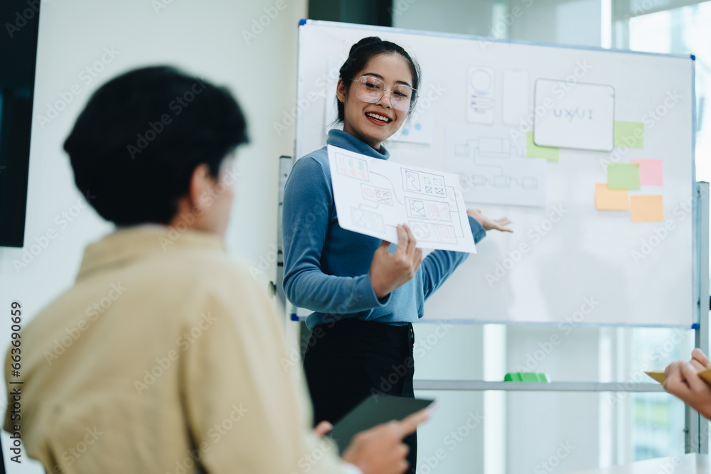 Group of asian creative team programing designers participate in all phases of the UX UI design. Group of asian creative team programing designers participate in all phases of the UX UI design.