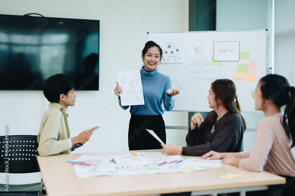 Group of asian creative team programing designers participate in all phases of the UX UI design. Group of asian creative team programing designers participate in all phases of the UX UI design.