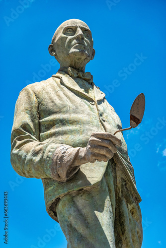 Sculpture of the painter and philanthropist Benito Quinquela Martin in La Boca neighborhood at Buenos Aires, Argentina photo