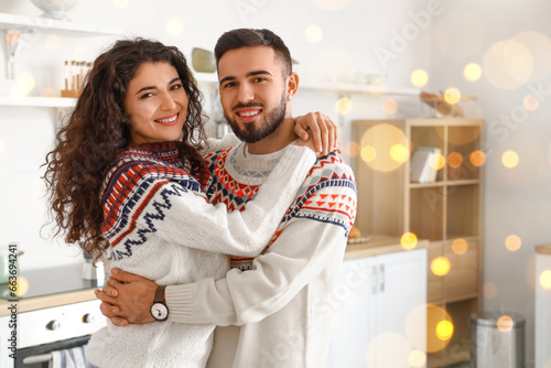 Happy young couple wearing ...