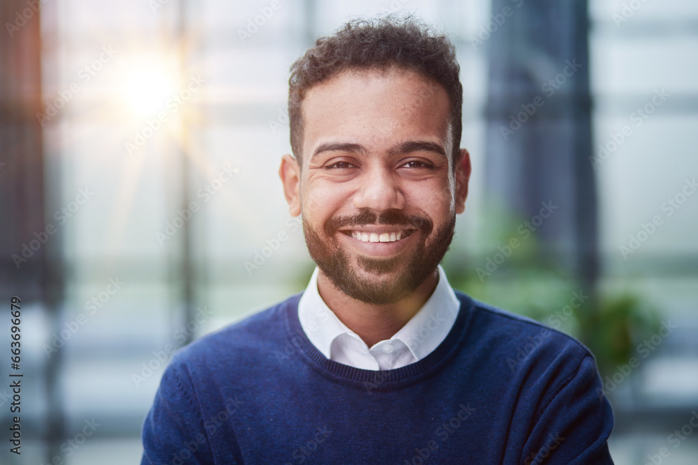 Smiling millennial confident black guy posing for photo, looking at camera