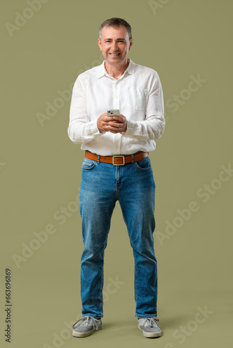 Mature man with mobile phon...