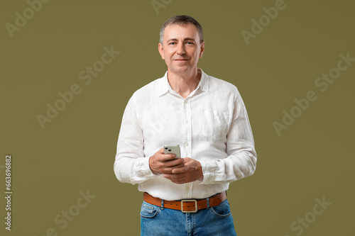 Mature man with mobile phon...