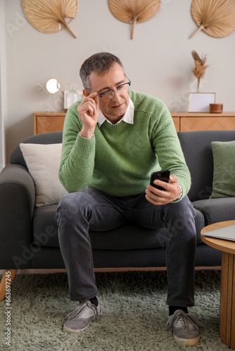 Mature man with mobile phon...