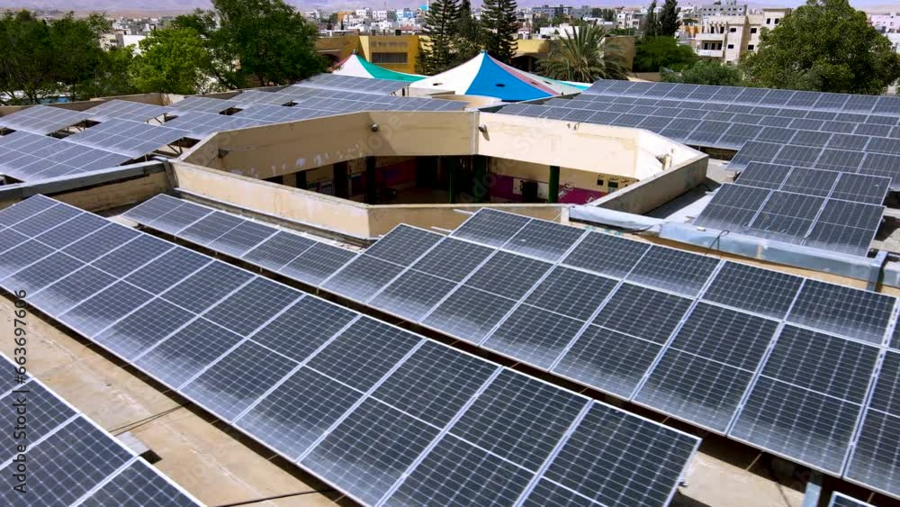 Solar panels on the roof of a school in the Negev desert in southern Israel.
Ariel Dron Shot. Solar panels on the roof of a school in the Negev desert in southern Israel.
Ariel Dron Shot.