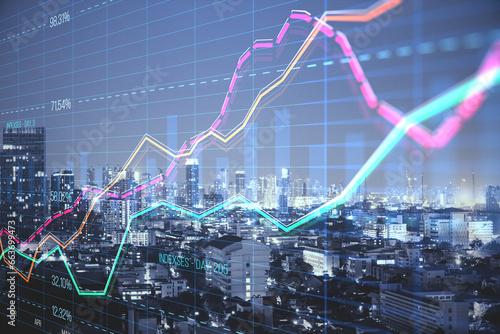Abstract creative business graph with index and grid on blurry city background with skyscrapers. Stock market and financial statistics concept. Double exposure. photo