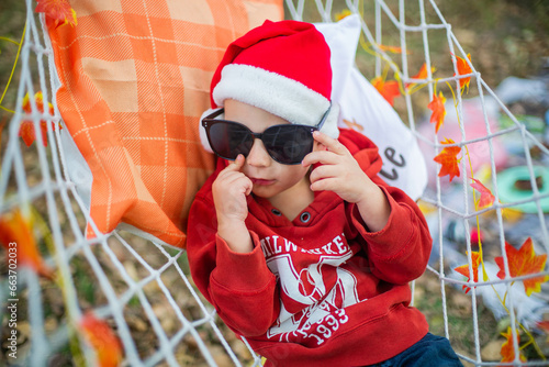 baby in red santa claus hat waiting for Christmas