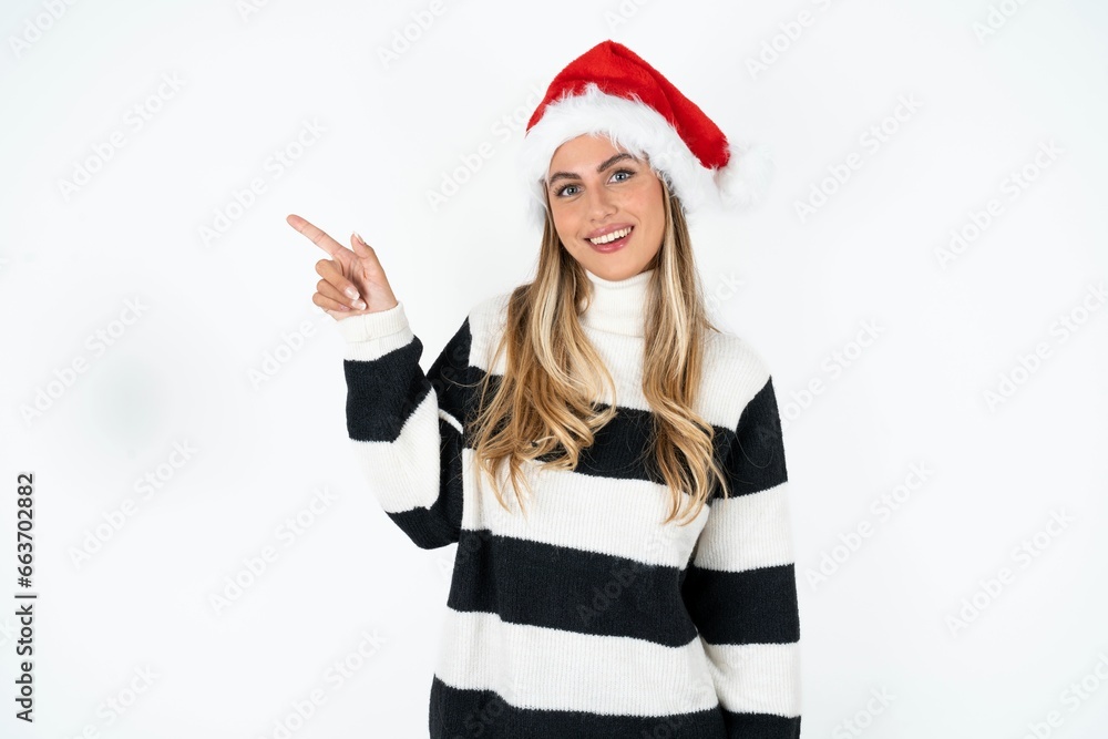 Young beautiful woman looking at camera indicating finger empty space sales Young beautiful woman looking at camera indicating finger empty space sales