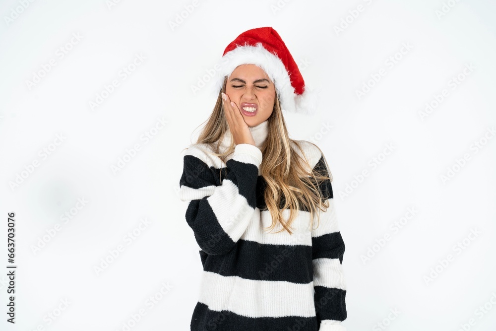 Young beautiful woman touching mouth with hand with painful expression because of toothache or dental illness on teeth. Young beautiful woman touching mouth with hand with painful expression because of toothache or dental illness on teeth.