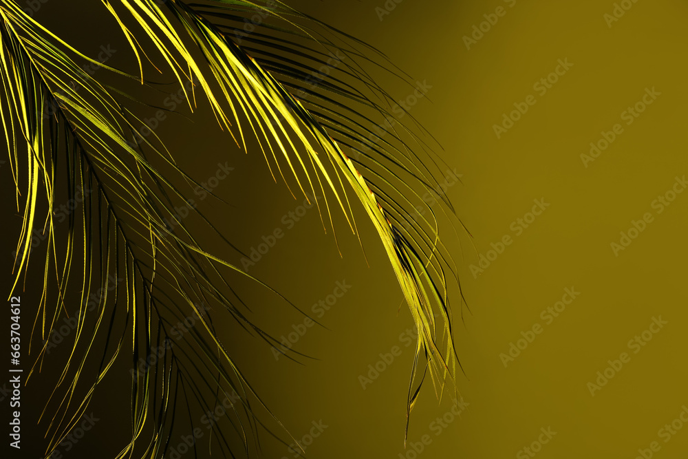 Neon tropical leaves on yellow background Neon tropical leaves on yellow background
