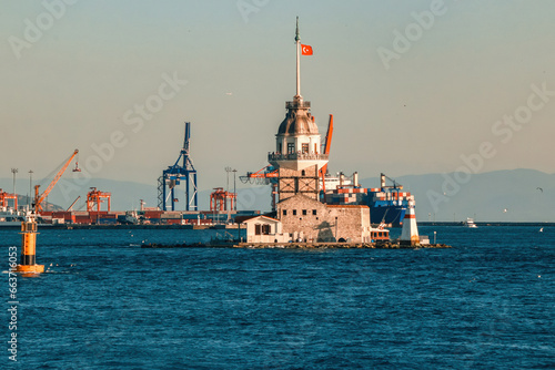 There is a shipyard in the background of the Maiden's Tower. Kiz Kulesi, Istanbul photo