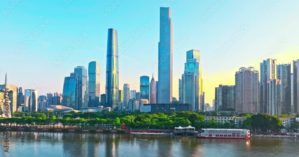 Aerial view of Guangzhou city financial district skyline at sunrise. Removed building trademark and advertising Aerial view of Guangzhou city financial district skyline at sunrise. Removed building trademark and advertising