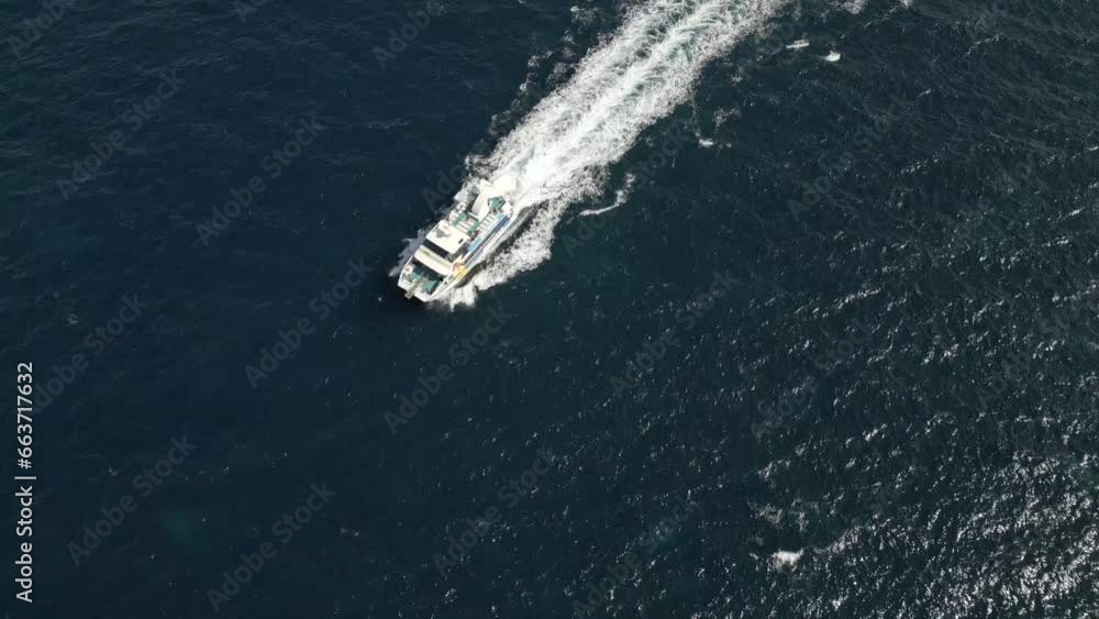 Aerial view catamaran sails in the open sea. Slow motion 4K Aerial view catamaran sails in the open sea. Slow motion 4K