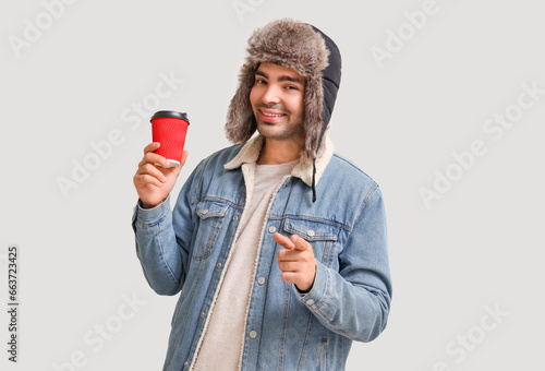 Young man with cup of mulle...