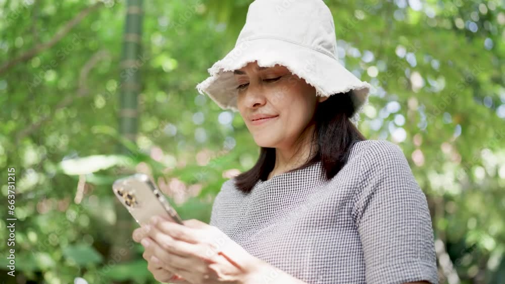 Woman uses mobile phone to tap scrolling screen of smartphone browsing social media app information Woman uses mobile phone to tap scrolling screen of smartphone browsing social media app information
