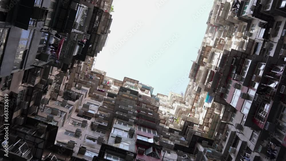 low angle of hong kong highrise resident apartments buidlings in Quarry bay, Montane Mansion, spinning cinematic shot low angle of hong kong highrise resident apartments buidlings in Quarry bay, Montane Mansion, spinning cinematic shot