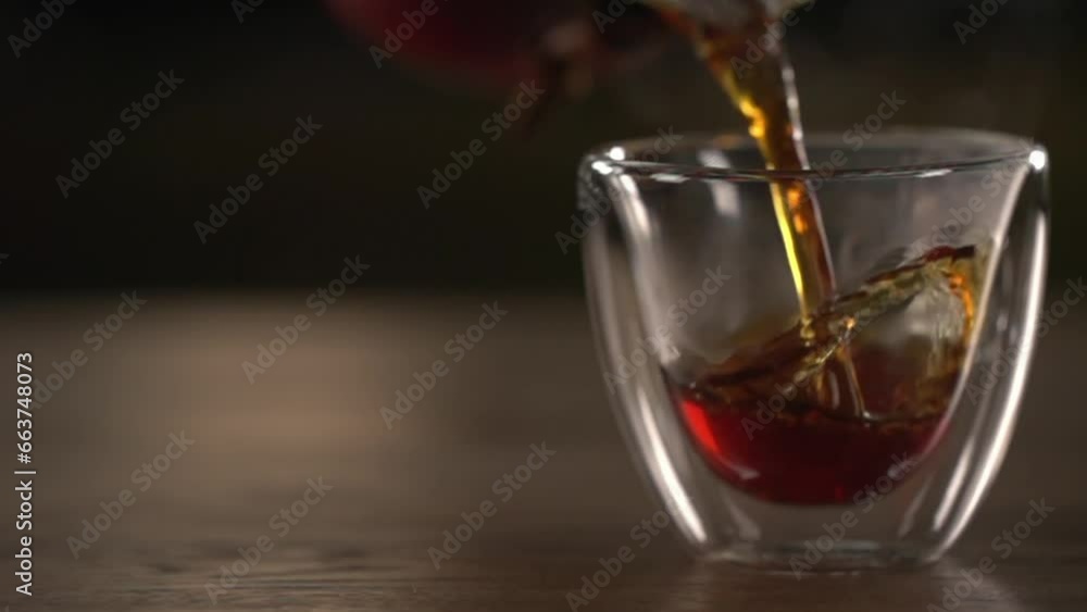 The small glass is slowly filled The small glass is slowly filled