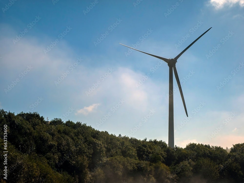 Wind power plant rotor close view. Windpower generator. Green energy, eco friendly industry concept Wind power plant rotor close view. Windpower generator. Green energy, eco friendly industry concept