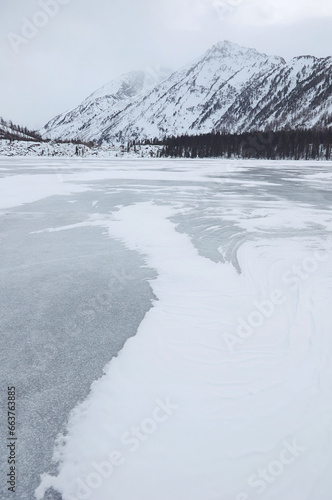 Snow-covered winter mountain lake, Russia, Siberia, Altai mountains. Multinskie lakes. photo