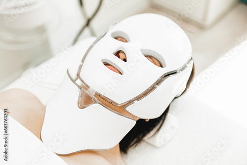 photon mask. Health and beauty. Cosmetic procedure for a woman's face. LED face mask, photon therapy. photo