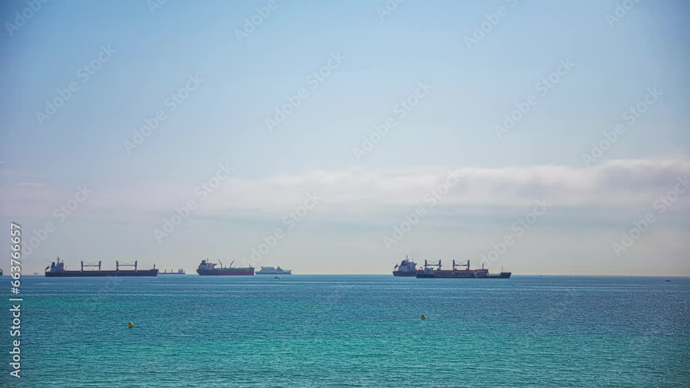Ships And Sailboat Cruising In The Mediterranean Sea In Algeciras, Spain. timelapse Ships And Sailboat Cruising In The Mediterranean Sea In Algeciras, Spain. timelapse