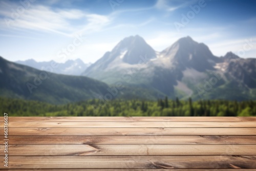 Close up of top of wooden table with blurred mountain background
