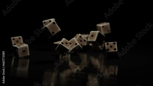 Dice cubes falling on a wooden table against a dark background