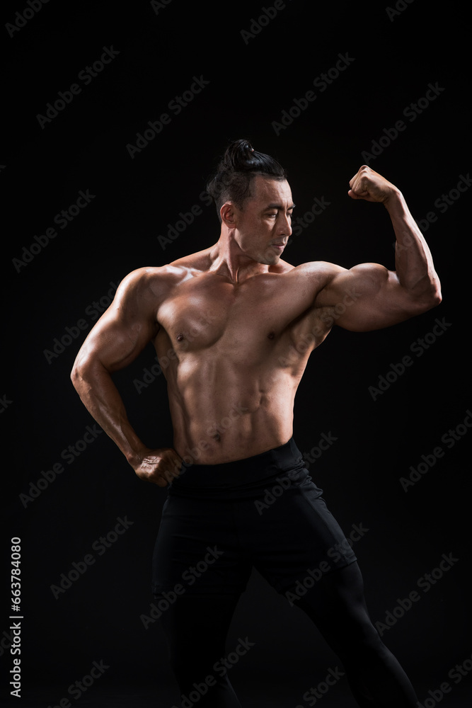 Strong, fit and sporty bodybuilder man over black background Strong, fit and sporty bodybuilder man over black background