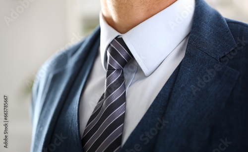 Photos Male arm in blue suit set tie closeup