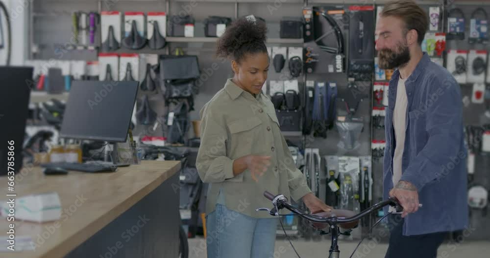 Female Customer Collecting Bicycle in Store Female Customer Collecting Bicycle in Store