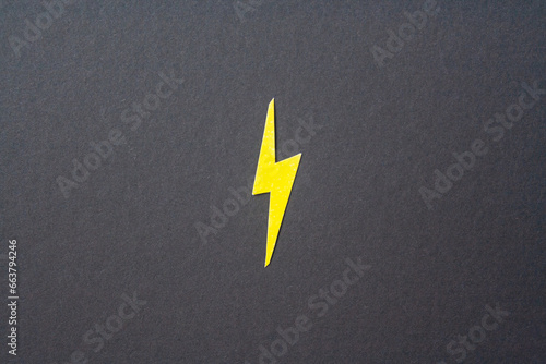 Yellow cut out lighting on black background. Idea concept. Energy and electricity. Innovation and thinking out the box symbols. Creativity and inspiration