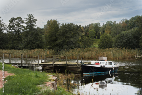 Small port and old boat on the river on the Åland Islands.
