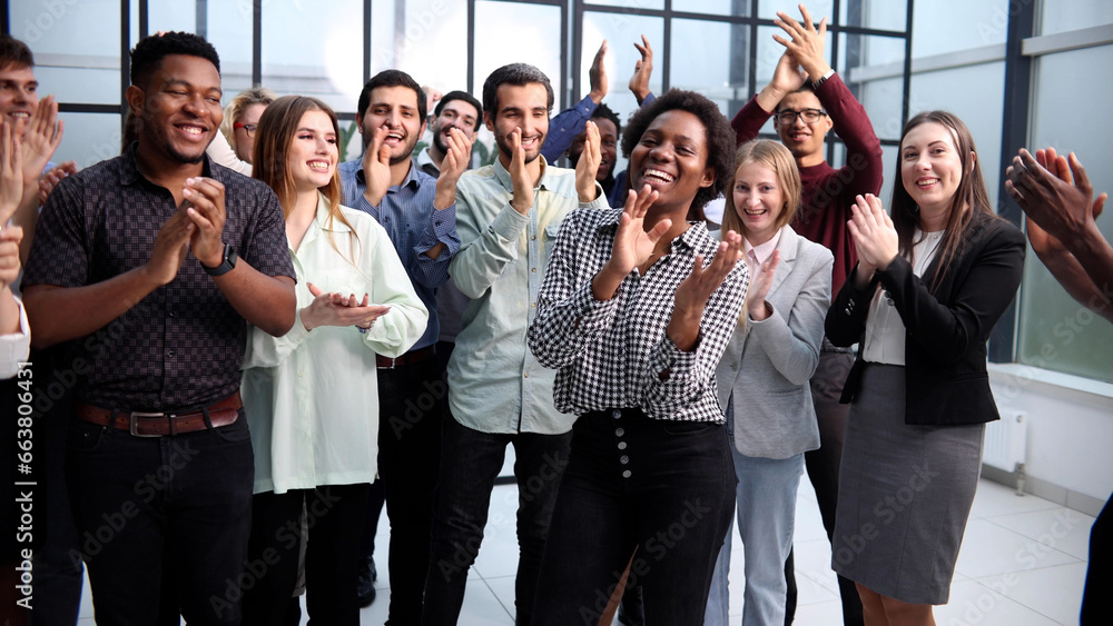 Business people clapping their hands after a seminar Business people clapping their hands after a seminar