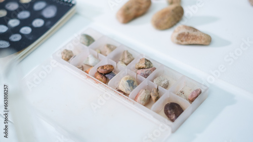 Sample of rocks testing or mineral in paleontology, archaeological and geological or mining laboratory. Concept of fossil research or soil experiment. Research and analysis history learning from ore.