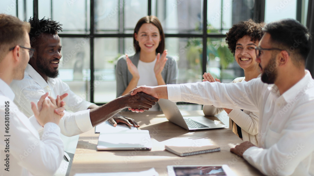 Fototapeta premium Congratulating the new partners in modern office