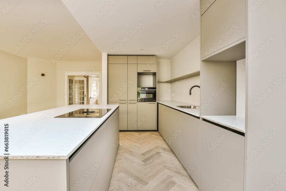 Renovated kitchen with white cabinets and appliances Renovated kitchen with white cabinets and appliances
