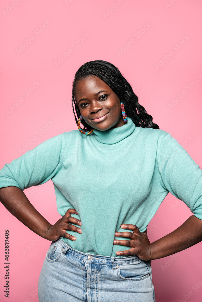 Smiling African woman with hands on hips Smiling African woman with hands on hips