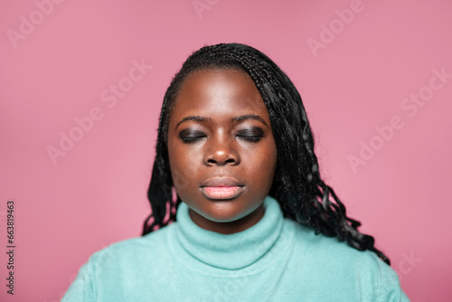 Portrait of African woman with closed eyes photo