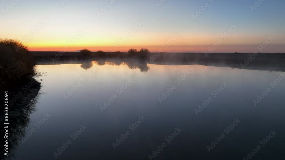 Shallow radiation fog that was formed by the cooling of water after sunset by infrared thermal radiation in calm conditions with a clear sky. Shallow radiation fog that was formed by the cooling of water after sunset by infrared thermal radiation in calm conditions with a clear sky.